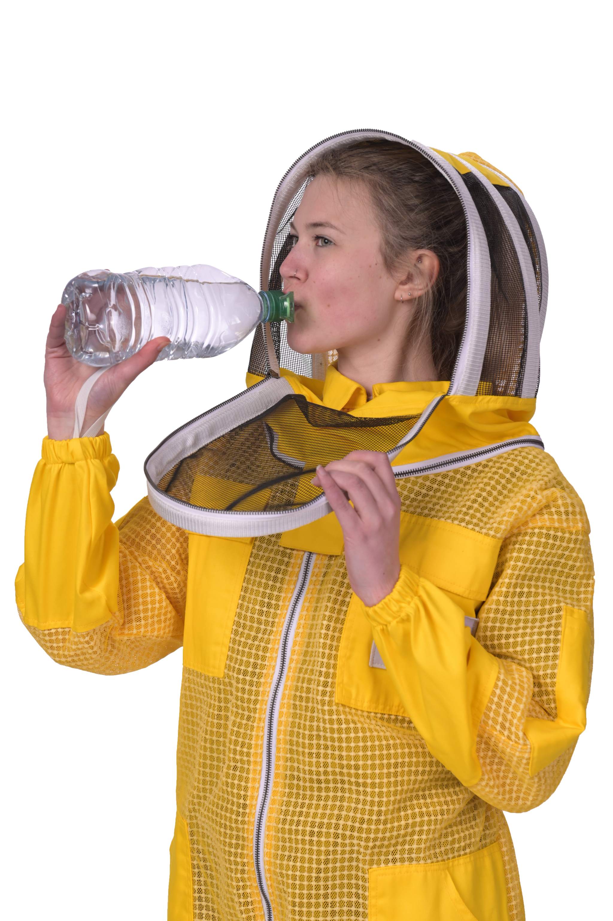 Women wearing a yellow beekeeping suit drinking from a water bottle.